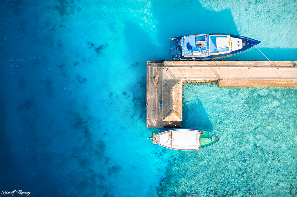 Maldives Gallerie maldives fish boats around pontoon blue water